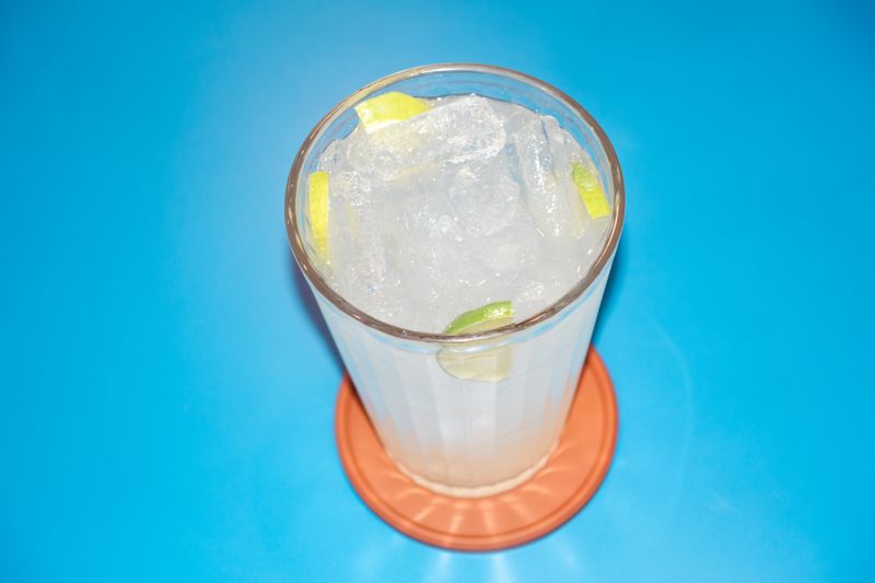 Fresh lemonade cold drink with ice and lemon slices