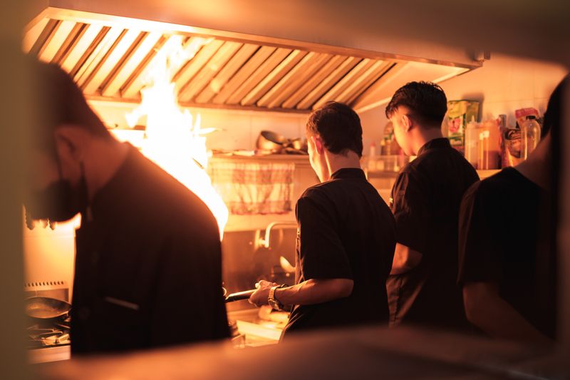 dedicated chef preparing mod pizza with fresh ingredients